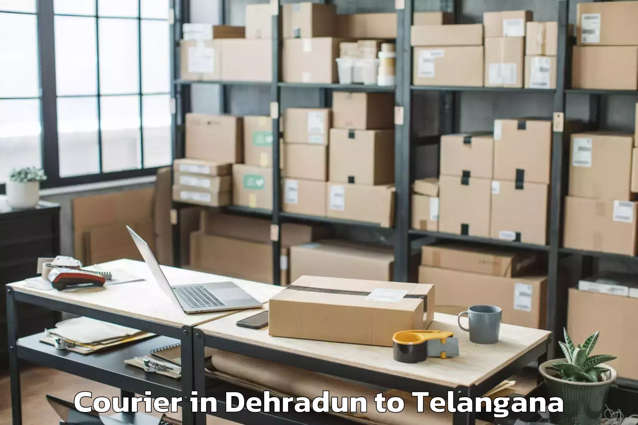 Book Dehradun to Huzurabad Courier Online